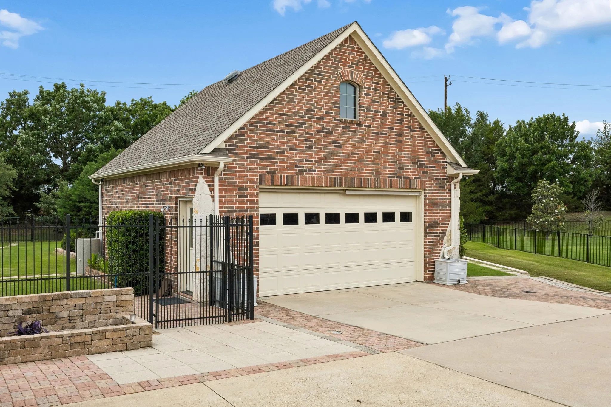 In addition to an attached 3 car garage, property offers a stand-alone garage and
workshop with two-level shelving, attic storage,
and enough space for two vehicles.