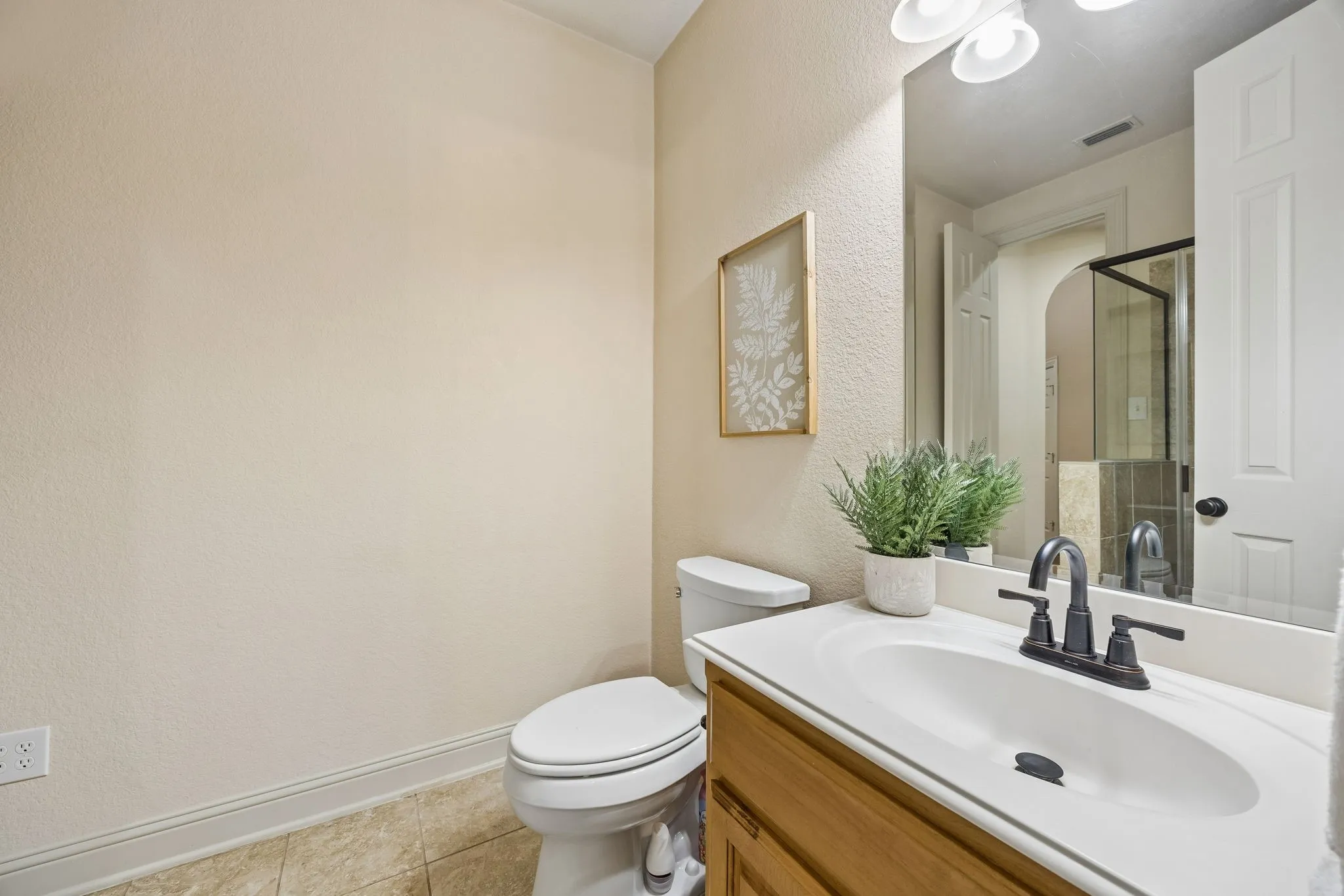 This full bath with shower is off the split guestroom, all on the first level