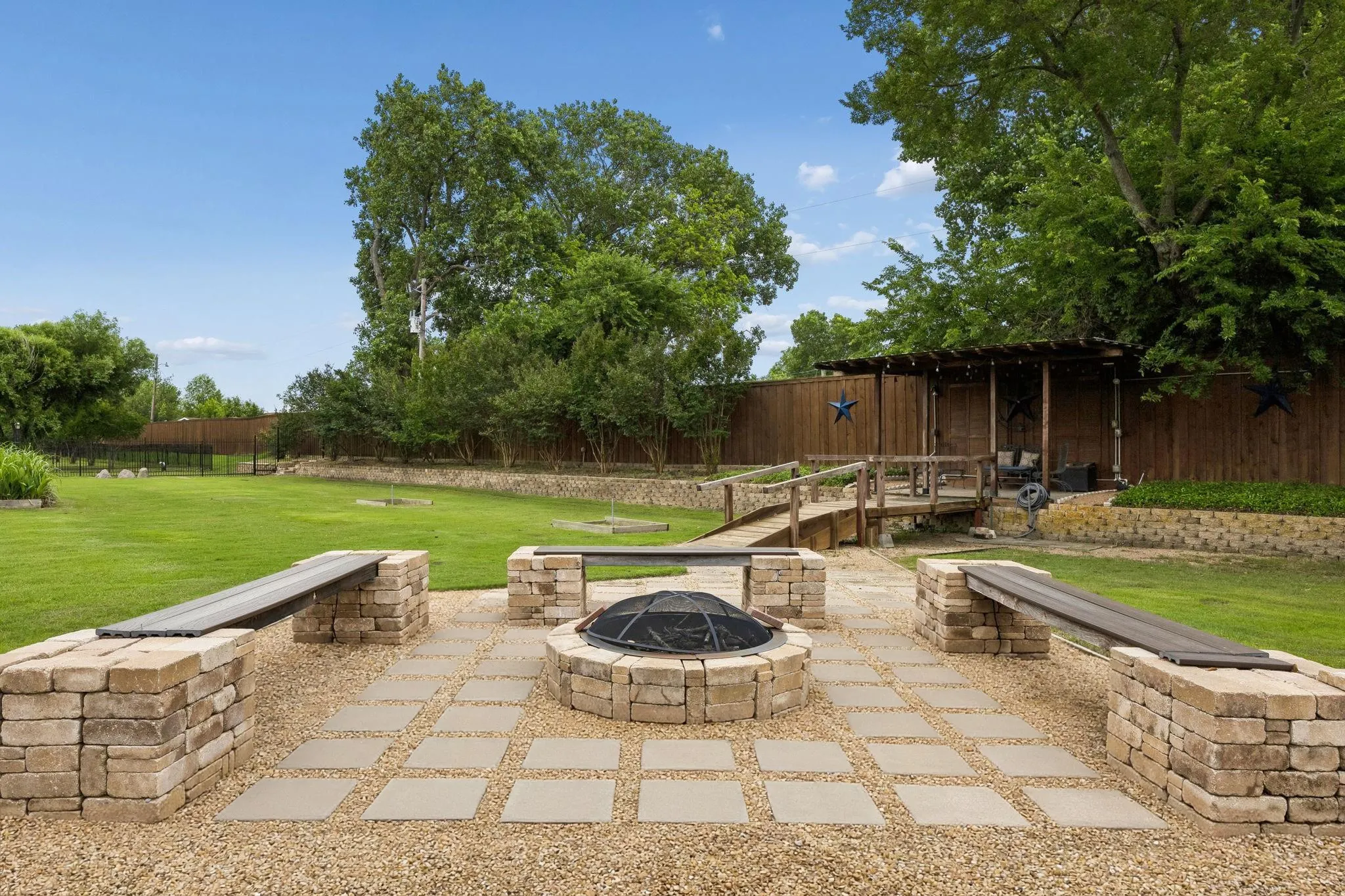 Your backyard is like a resort here! How about a firepit for cool evenings.  Also a nice little retreat along the back fenceline where you can enjoy the view!