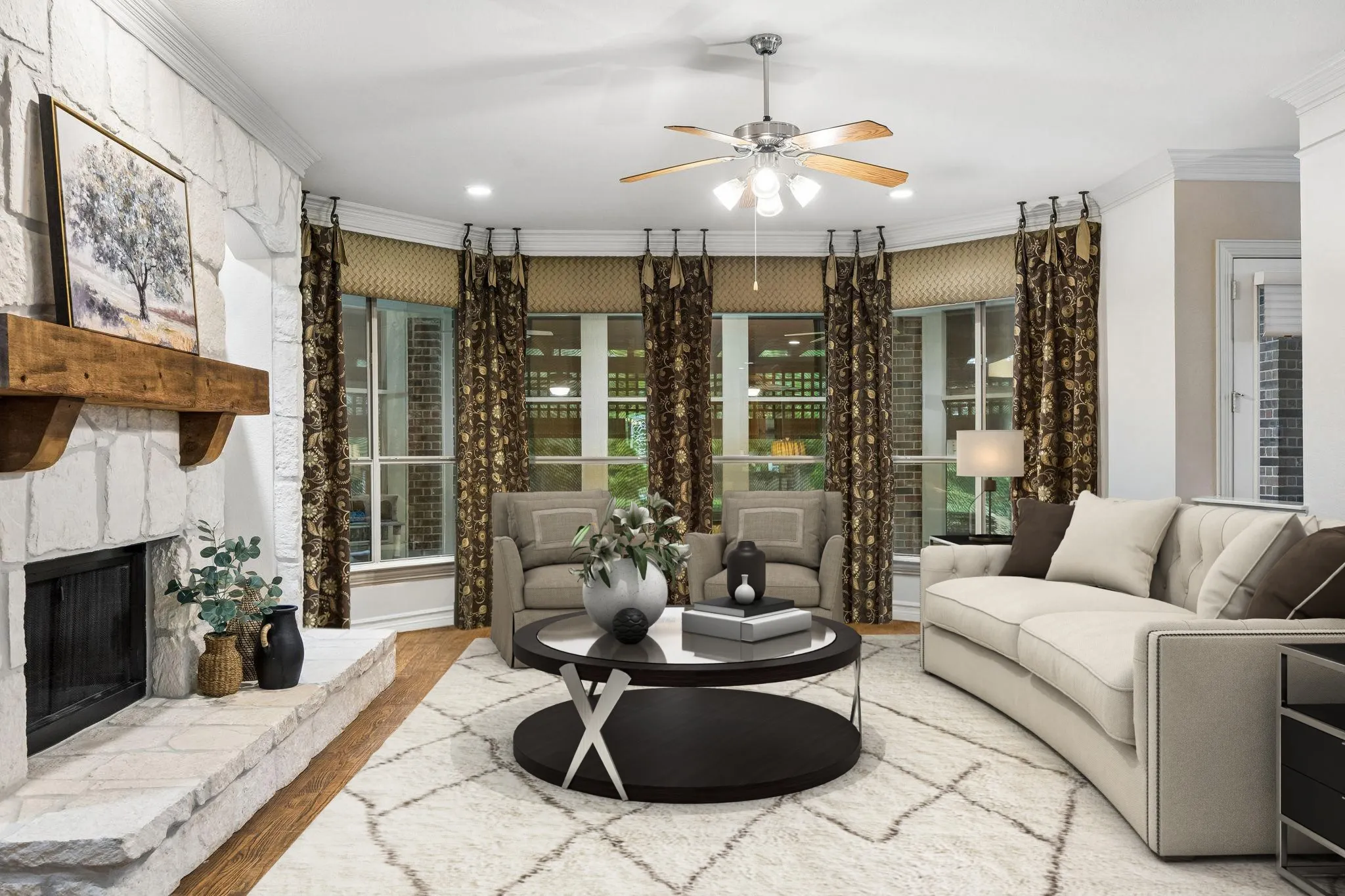 The family room over looks the backyard and has
stone fireplace, hand scraped hardwood flooring,
crown moulding and ceiling fan.