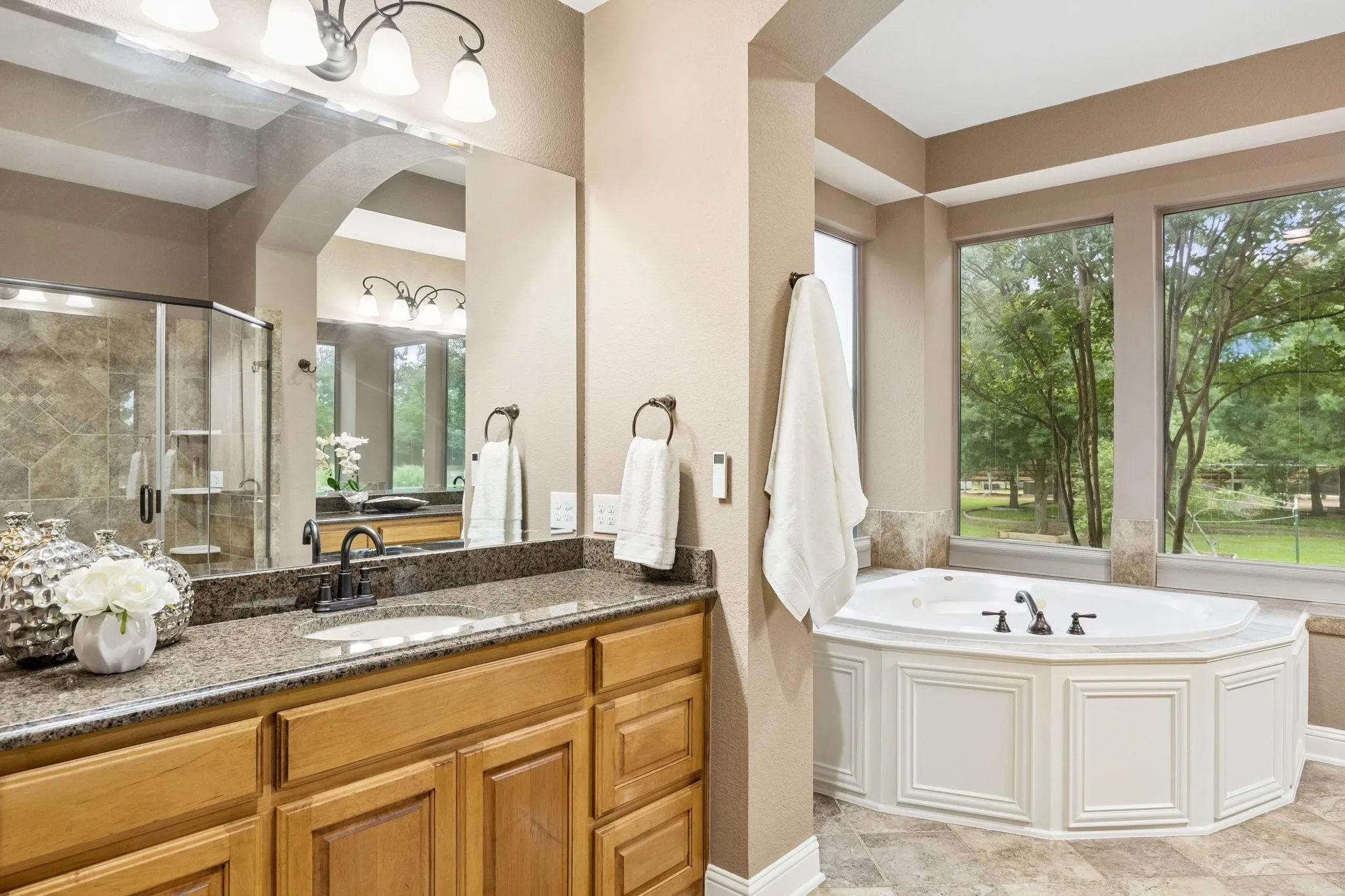 This bathroom is a dream! Oversized walk-in
shower with updated surround, attachments &
shelves as of 2024.(Window curtains are present, not shown in picture)