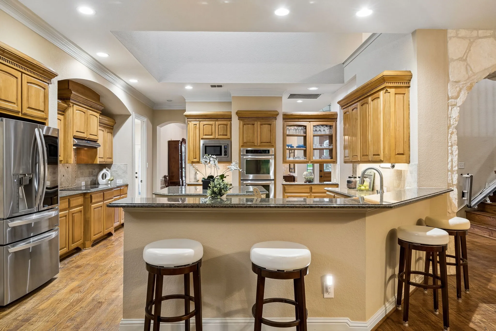 This is the perfect set up for entertaining. Find bar seating here as well as the island. The nook is just behind.