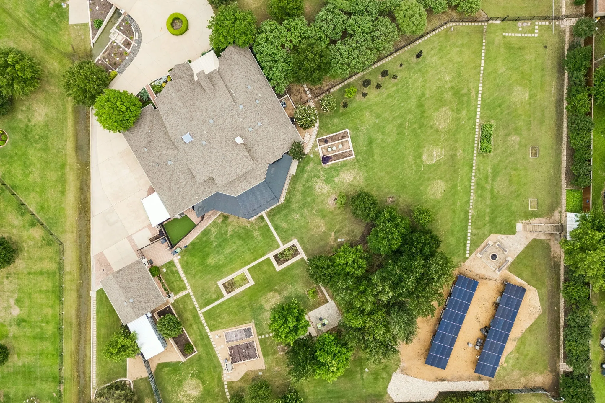 Aerial view of the home. Gutters feature leaf filters and connect to rain barrels at every downspout,
saving water and cutting maintenance.