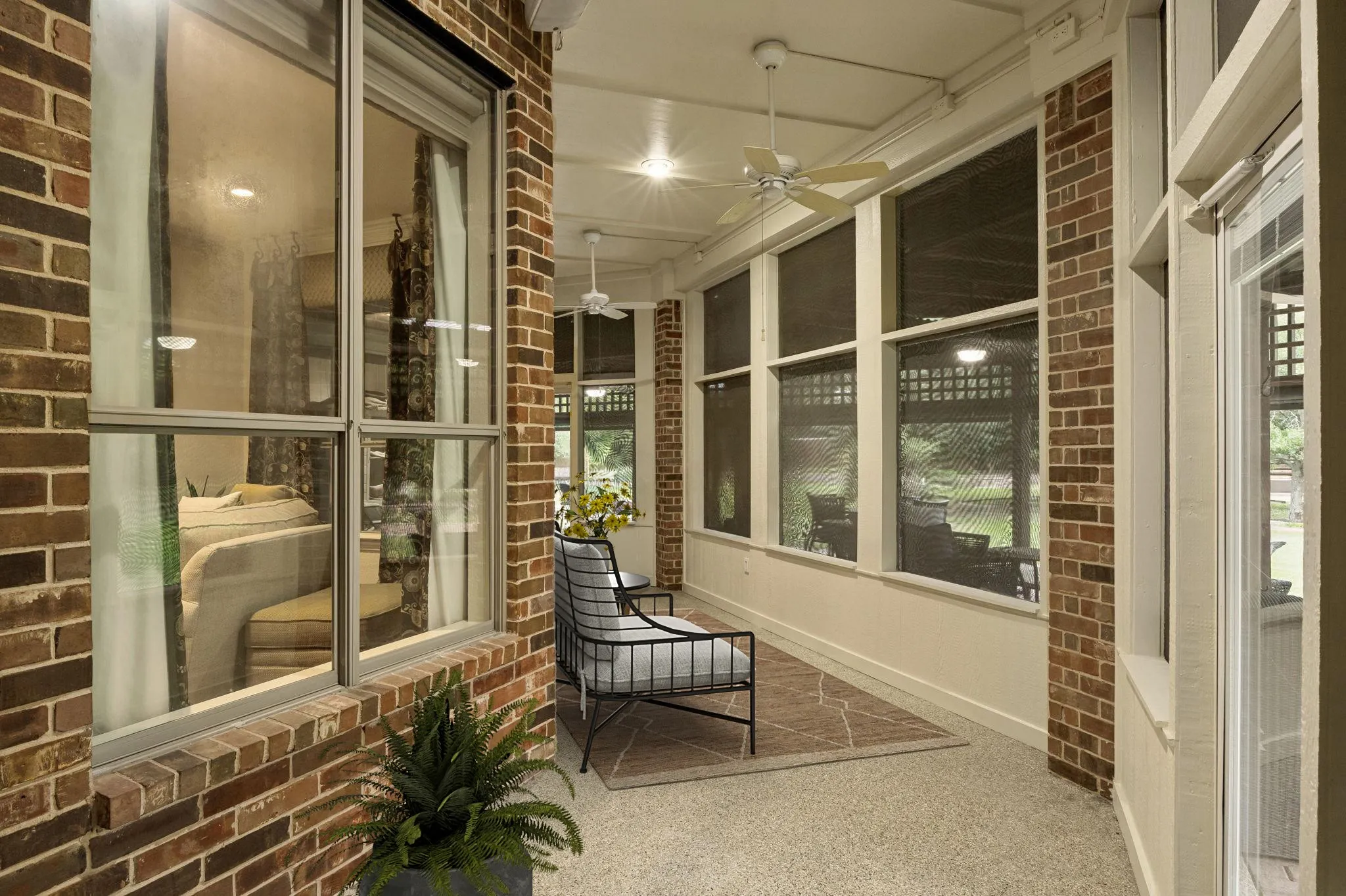 Screened patio off main living space and casual dining offers a retreat from the Texas Sun