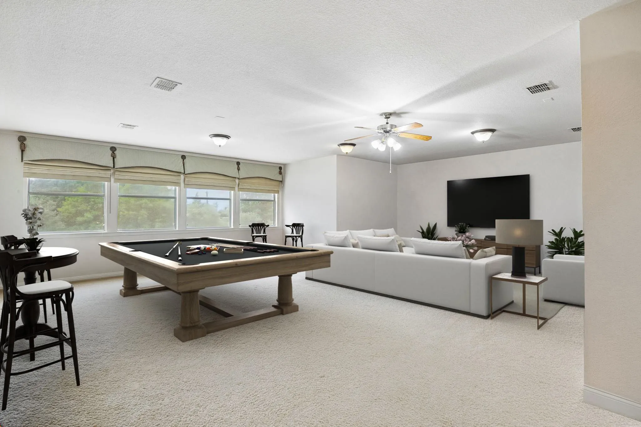 This huge space found just up the stairs is a perfect
game room - media room combination. The room
offers carpet, ceiling fan and a wall of windows with
views of the backyard. Off of this room find a large
walk-in storage closet and a powder room. Virtually
staged to show potential.