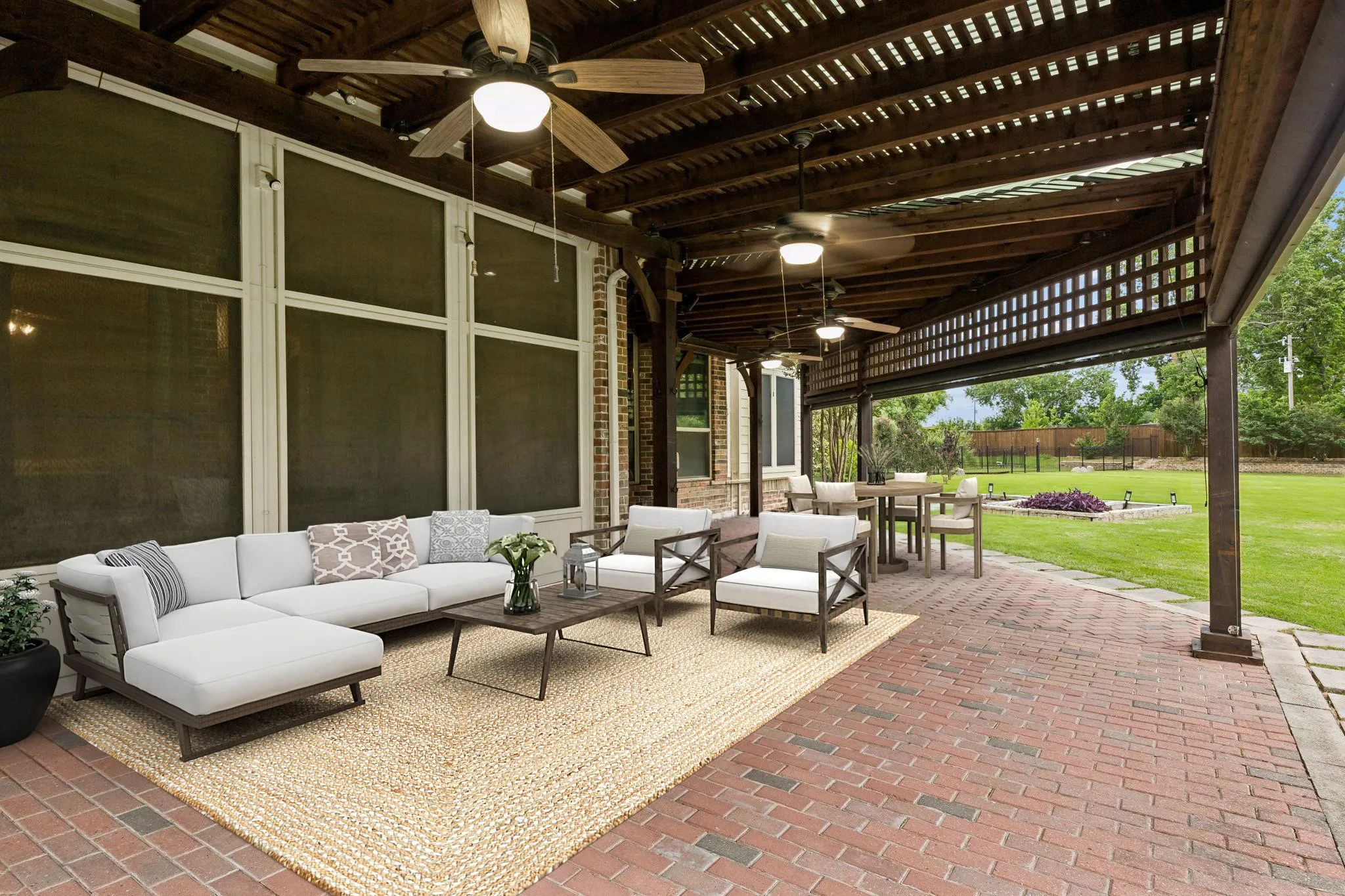 The backyard boasts a beautiful paver patio shaded
by wood arbors, perfect for relaxing or entertaining.
