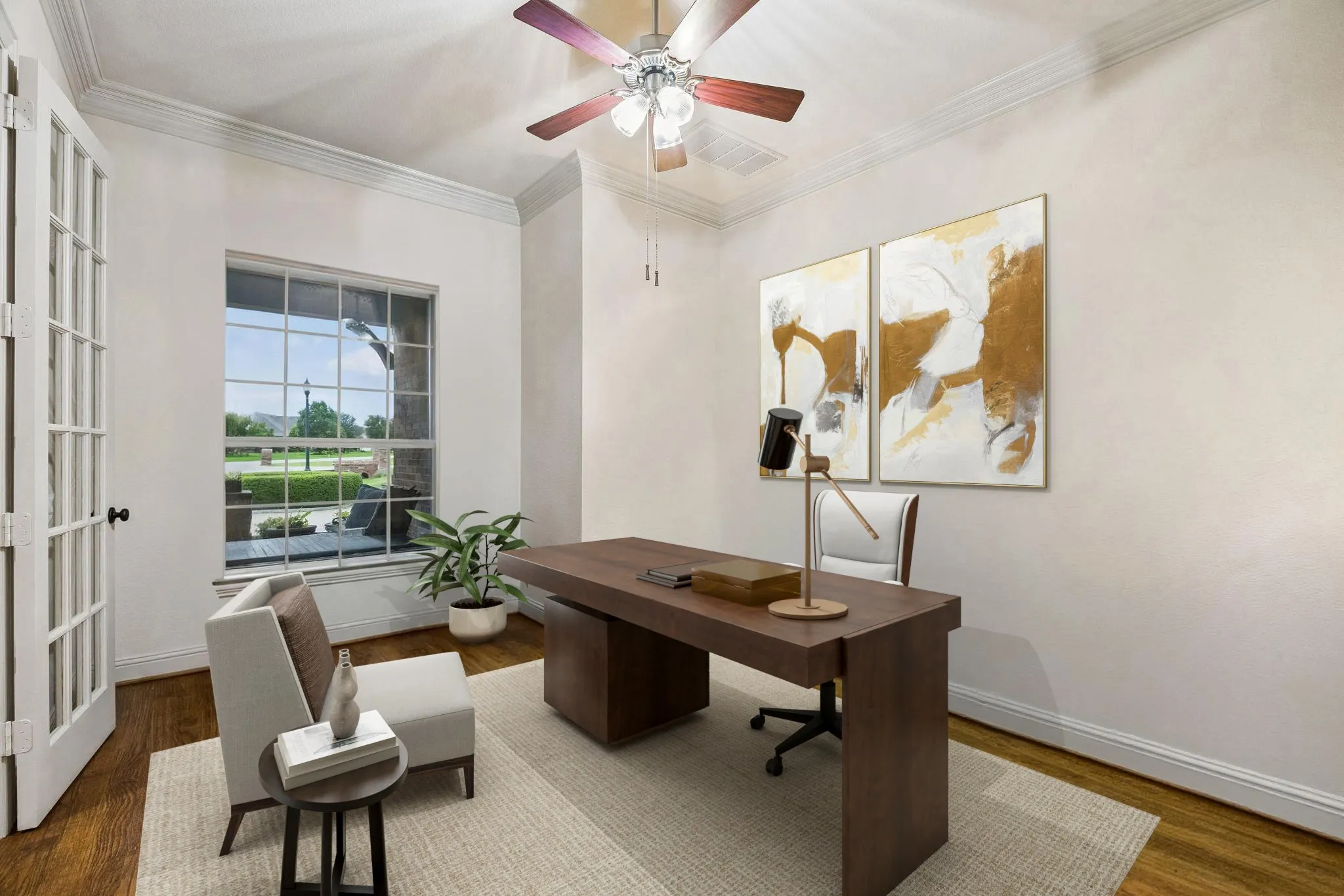 The private sitting room can also serve as a home office. The space offers french doors, crown molding, ceiling fan, and hand scraped hardwood flooring.