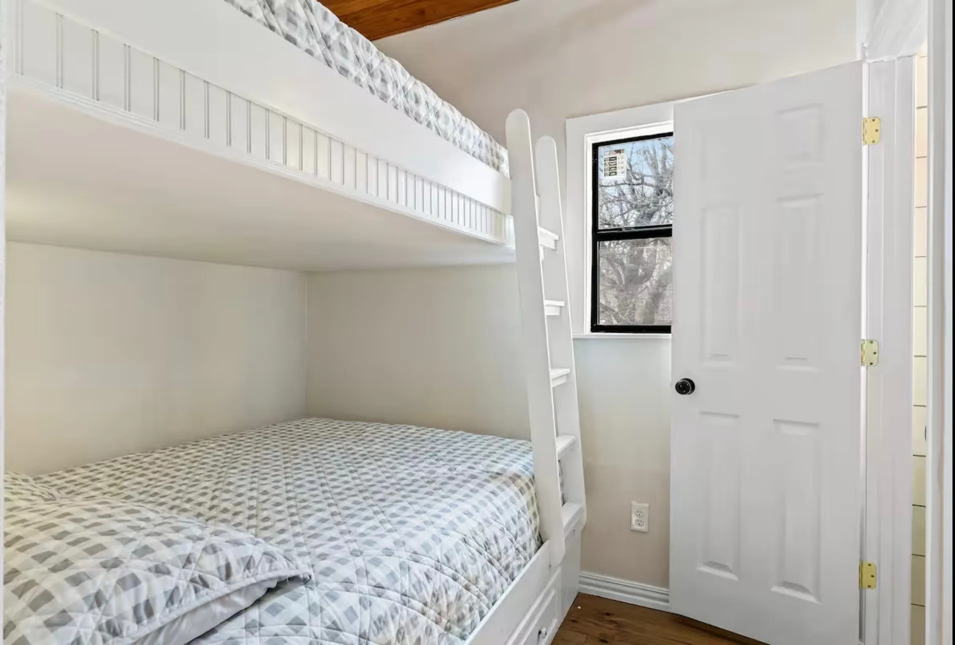 Bedroom 3 - Built-in bunk beds featuring beadboard detailing and an integrated ladder