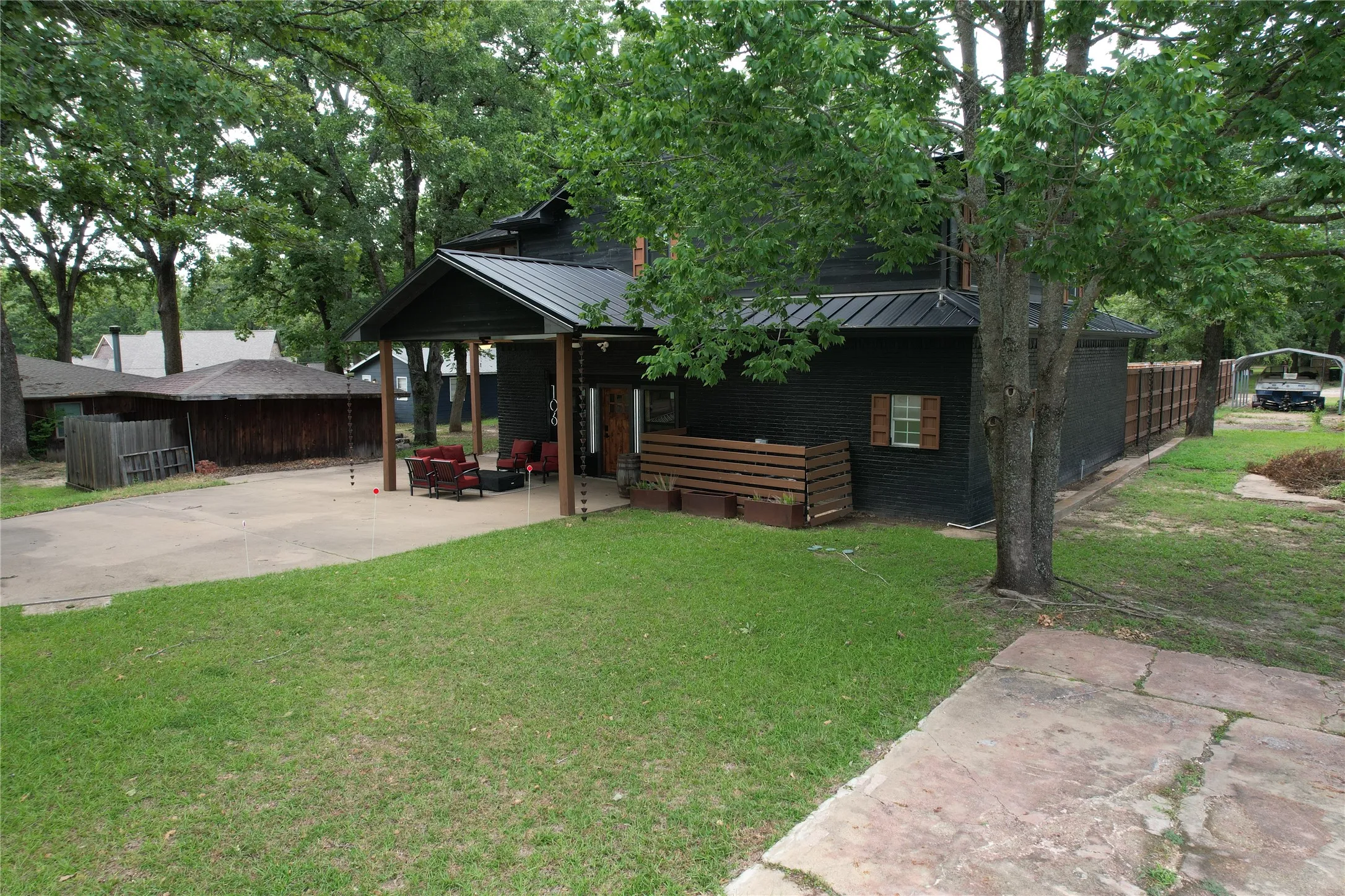 Red Oak Dr frontage of property has 2 lots - the lot the house sits on an adjacent lot with a concrete driveway