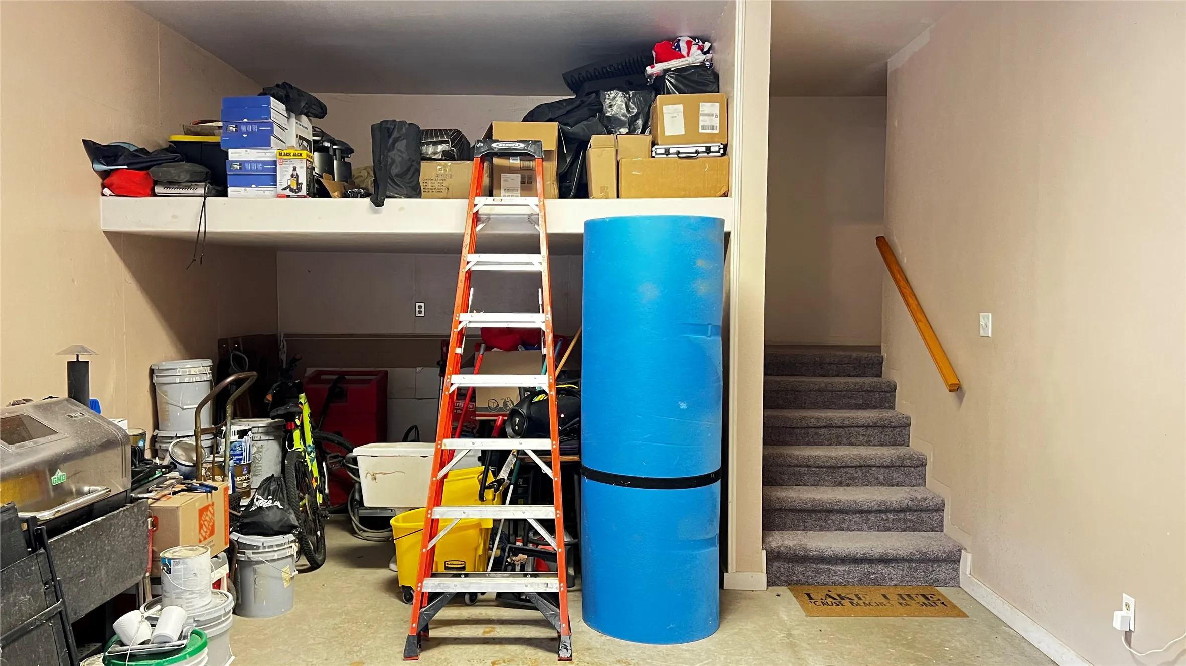 Interior staircase and potential workshop or storage area in Garage