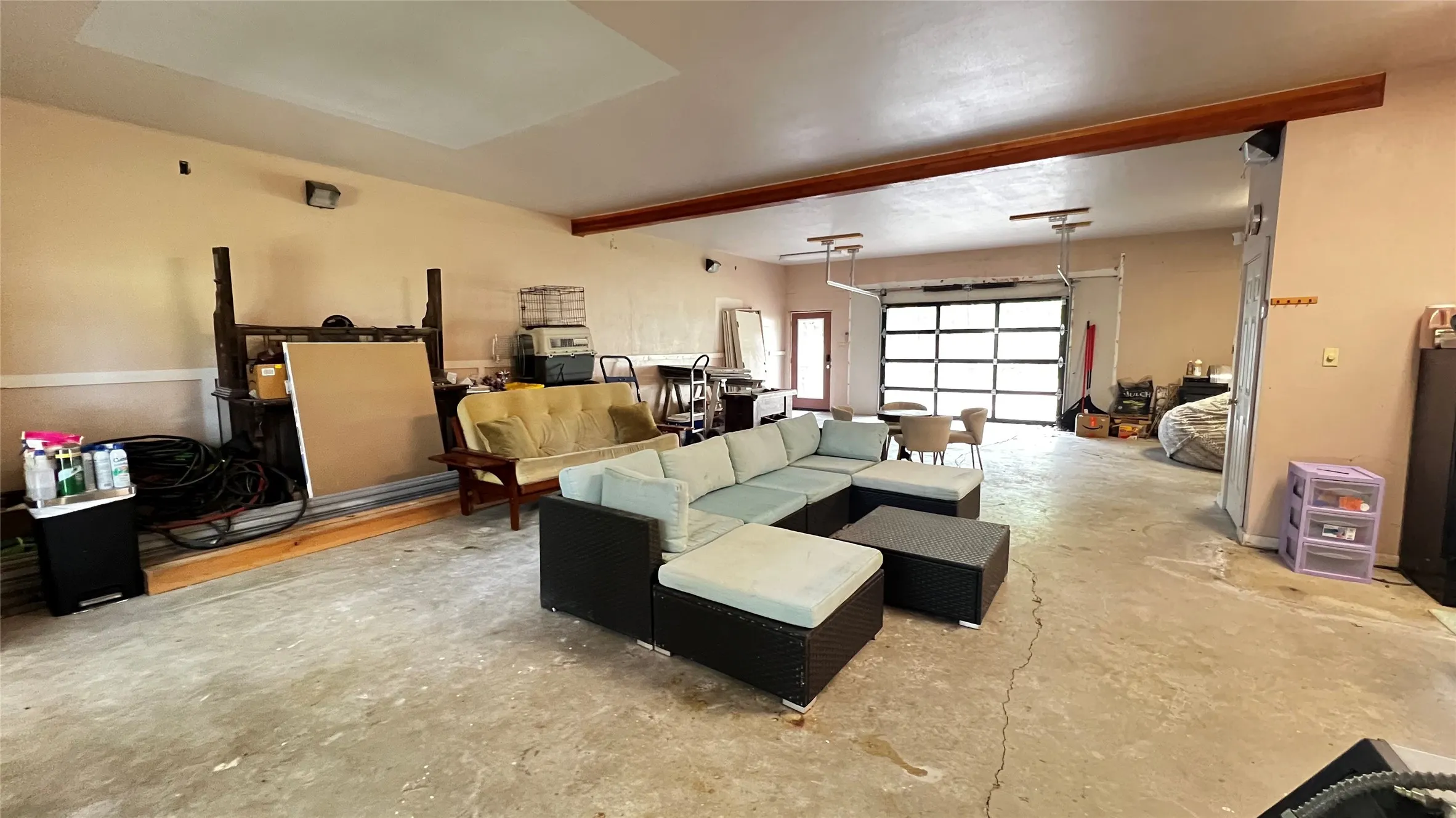 Barndo style garage living downstairs with ample room for auto parking, workshop, game room, or however you want to use this Barndo style space.