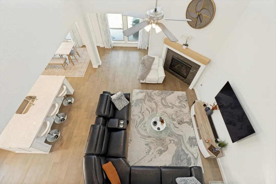 Open-concept living area with wood-finish flooring