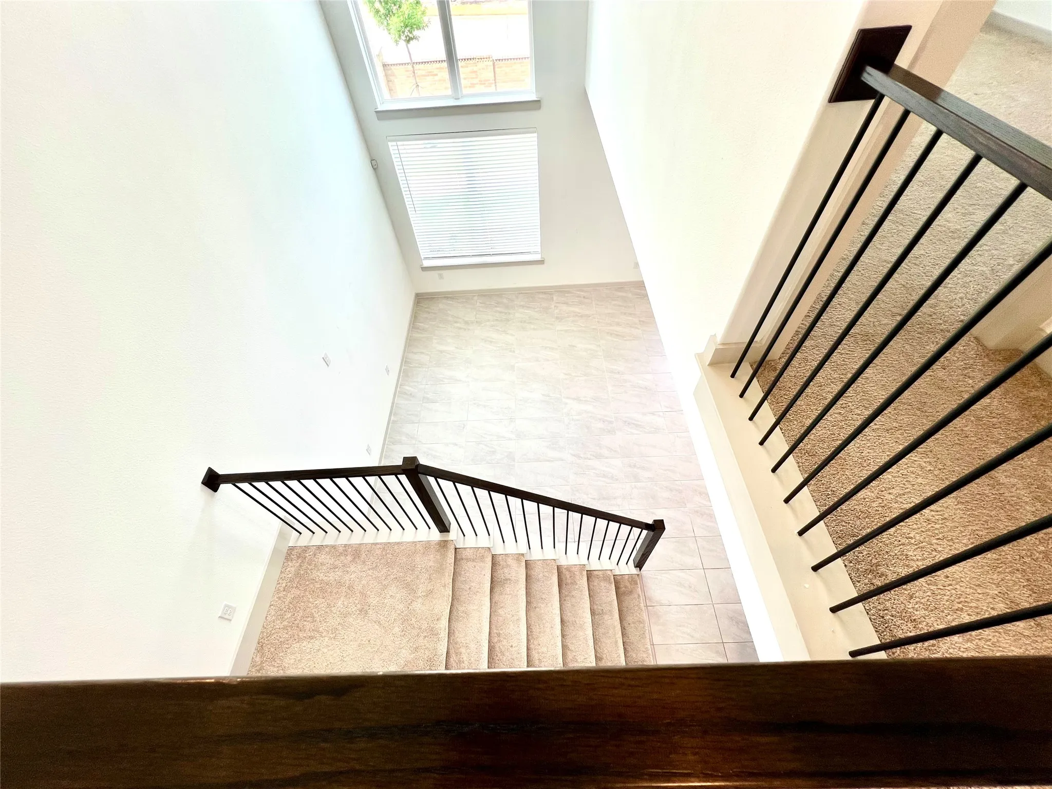 Staircase featuring tile patterned floors