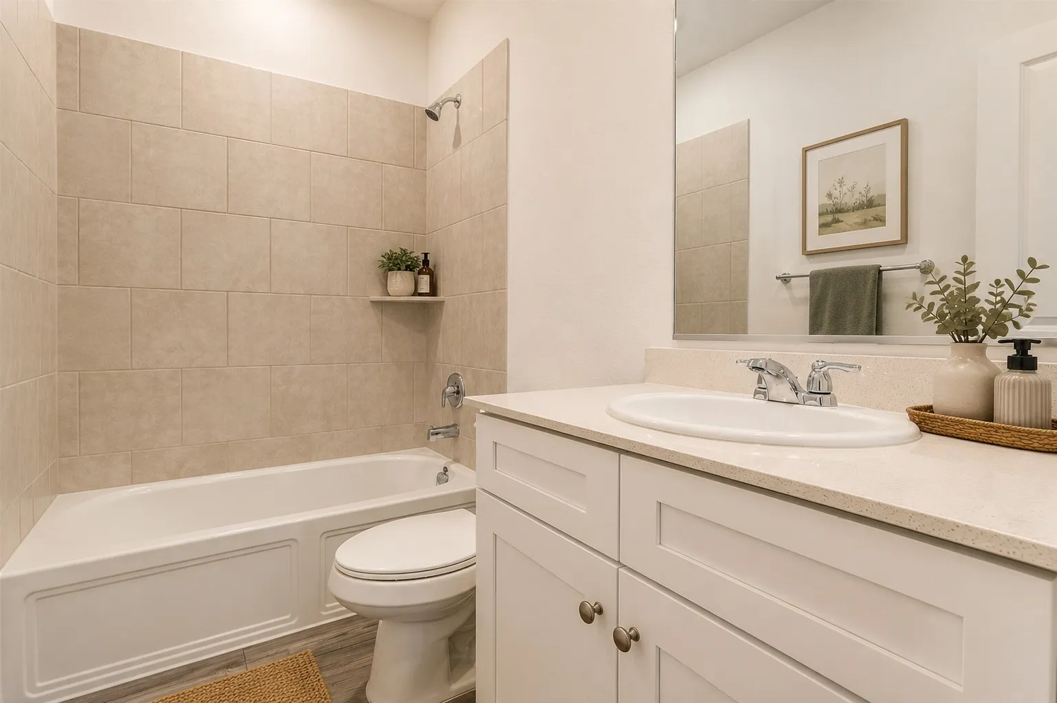 **Virtual Staged** Full bathroom featuring a white tub, shower with a single shelf, and a vanity with a white countertop