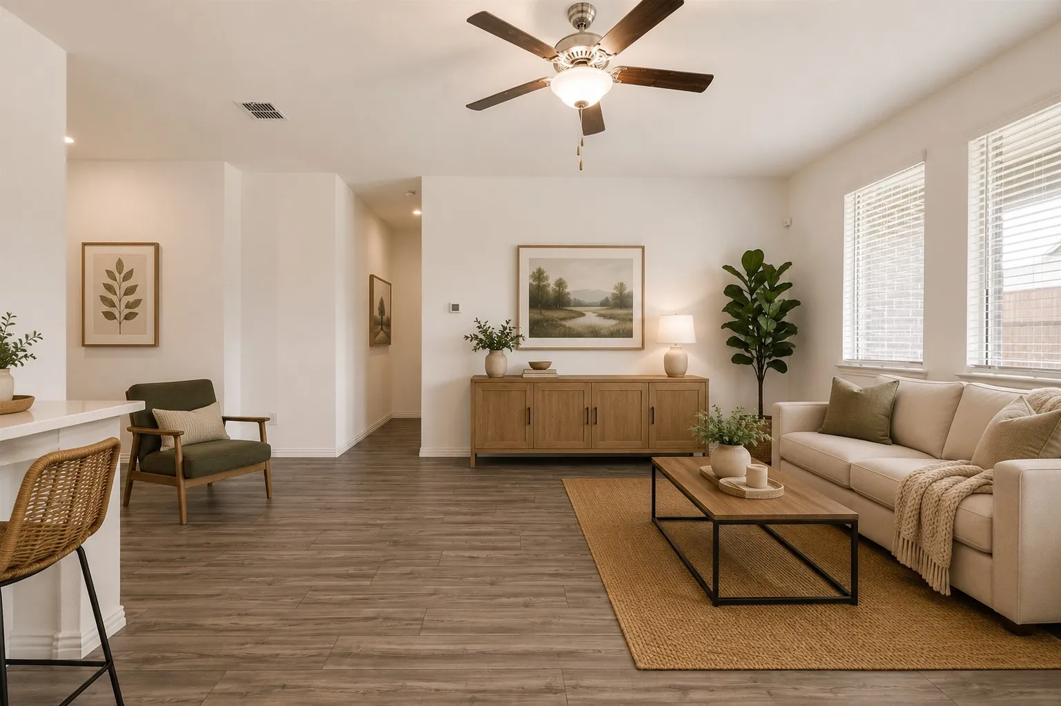 **Virtual Staged** Spacious living area featuring wood-finish flooring, recessed lighting, and a ceiling fan with integrated light fixture