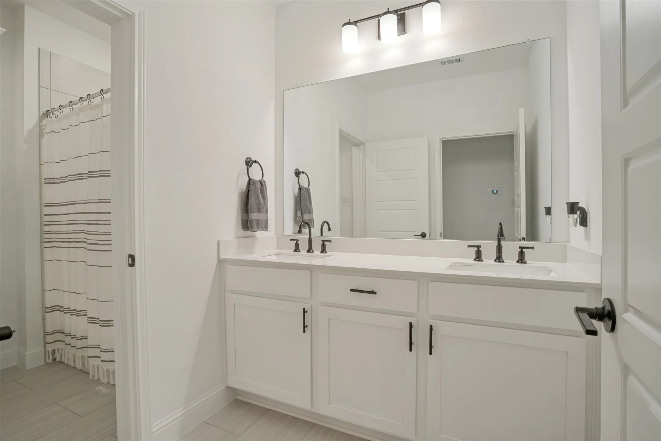 Third full bath located upstairs.