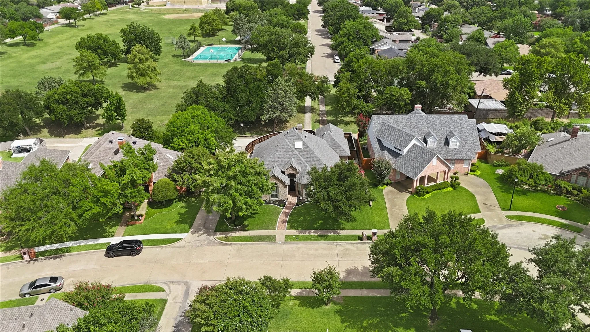 Park behind house, playset, basketball courts, softball field...