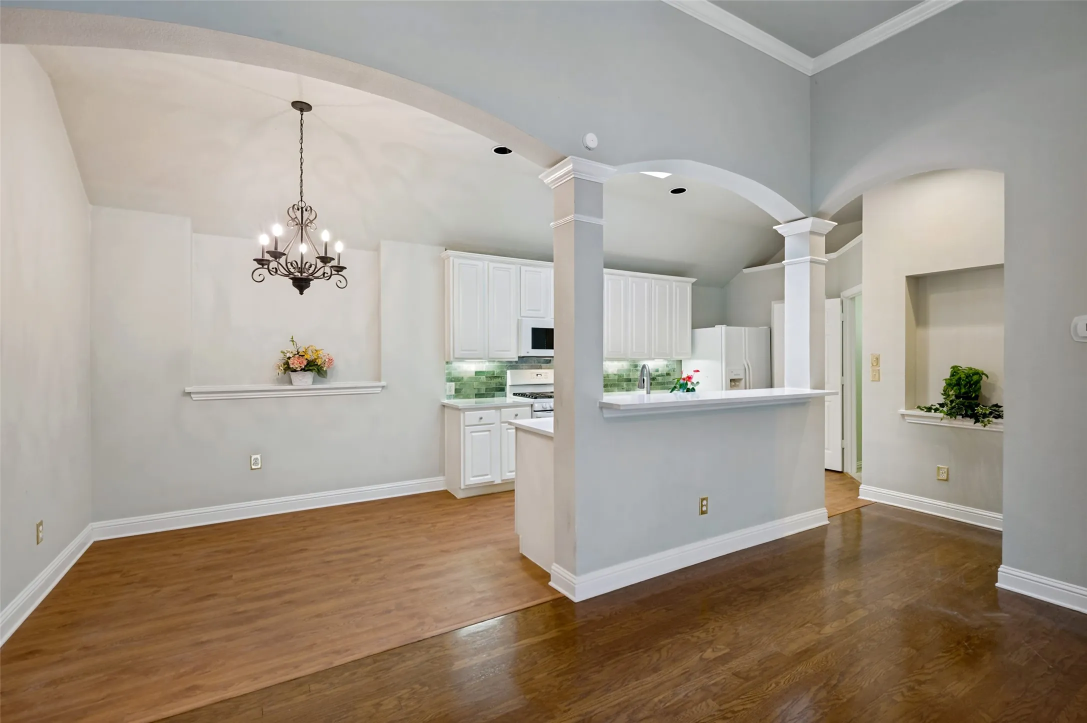 Brand new custom granite counter tops with arched ceiling accents.