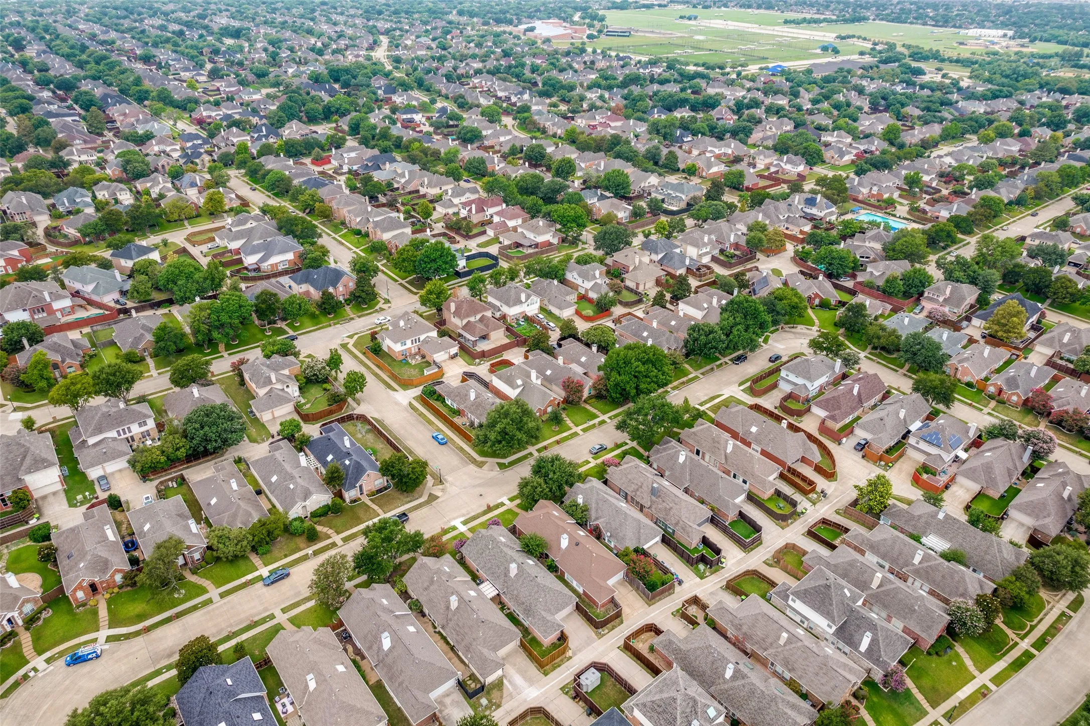 Residential neighborhood showcasing a grid street pattern and mature tree canopy