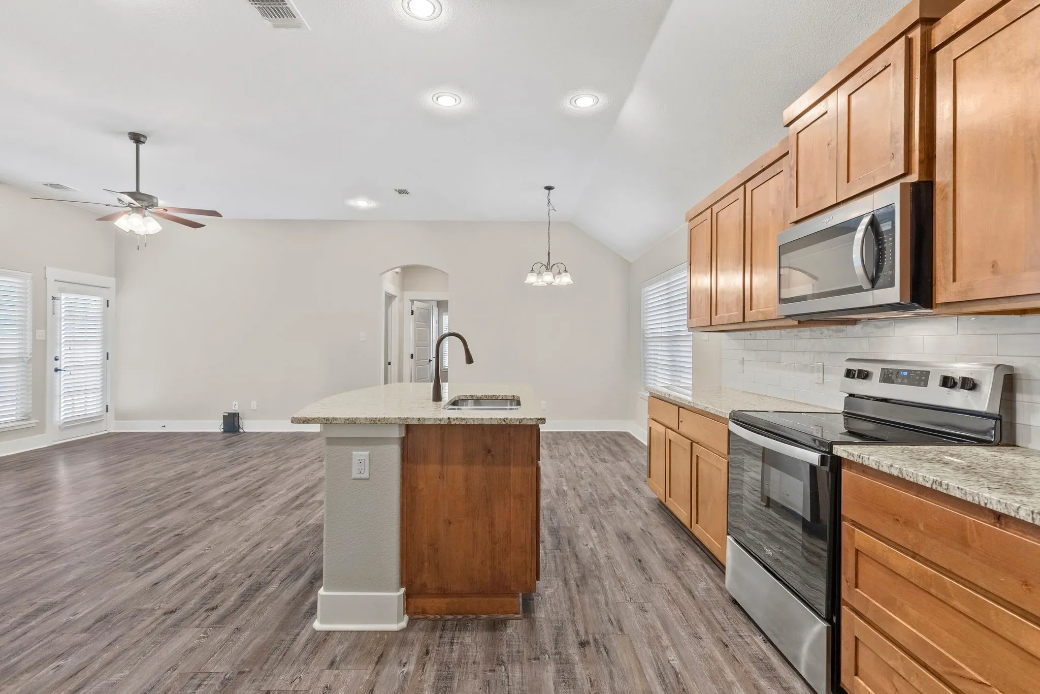Kitchen, Dining area, Family room, door to covered patio area