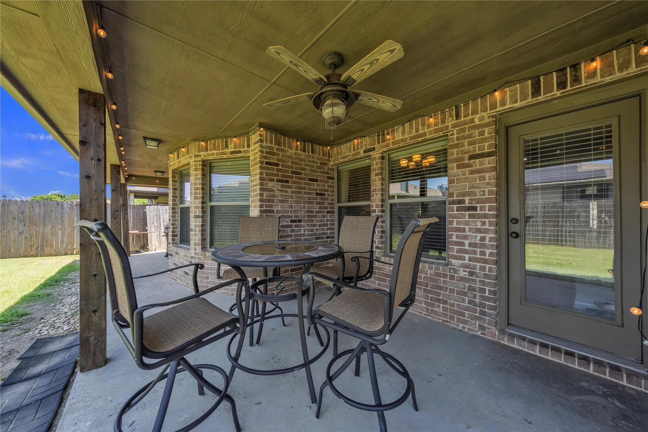 Covered patio featuring a ceiling fan, recessed lighting, and string lights