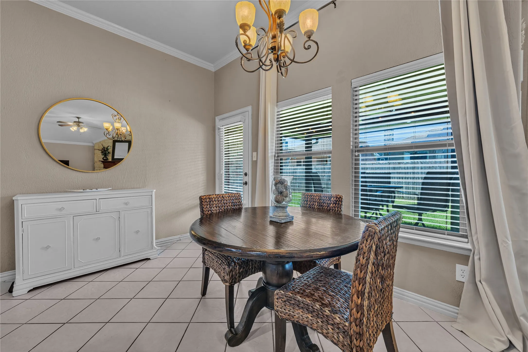 Dining area featuring light-colored walls and tile flooring