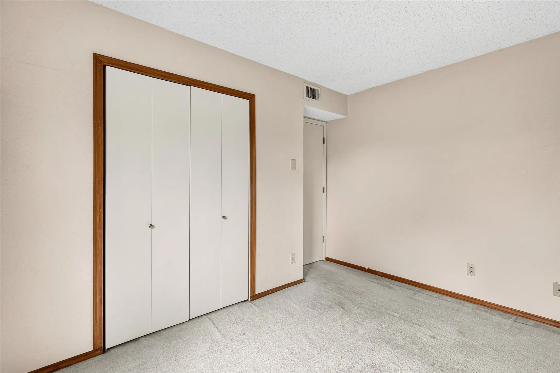 Opposite view with closet.