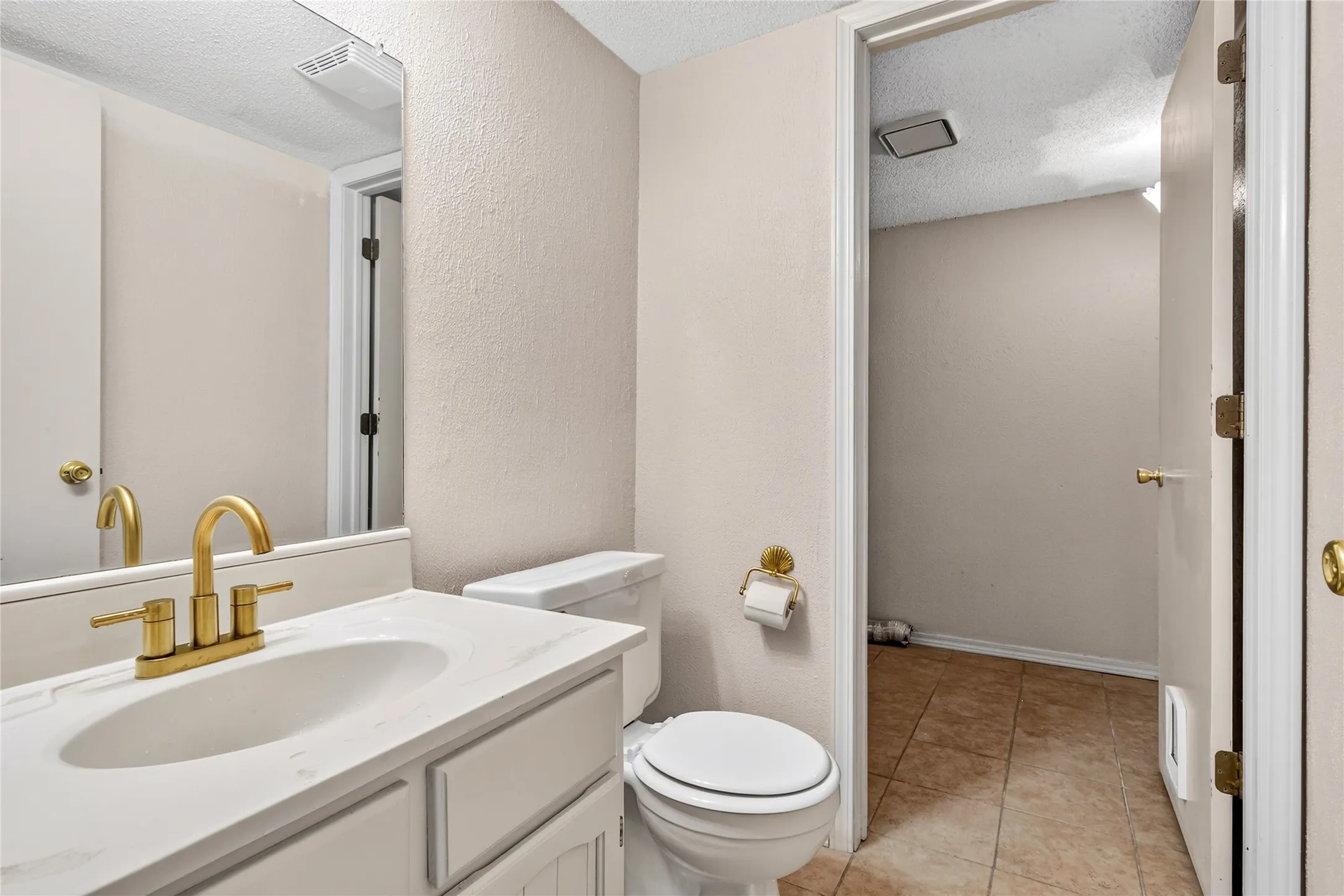Half Bath on the first level, inside is the laundry room.