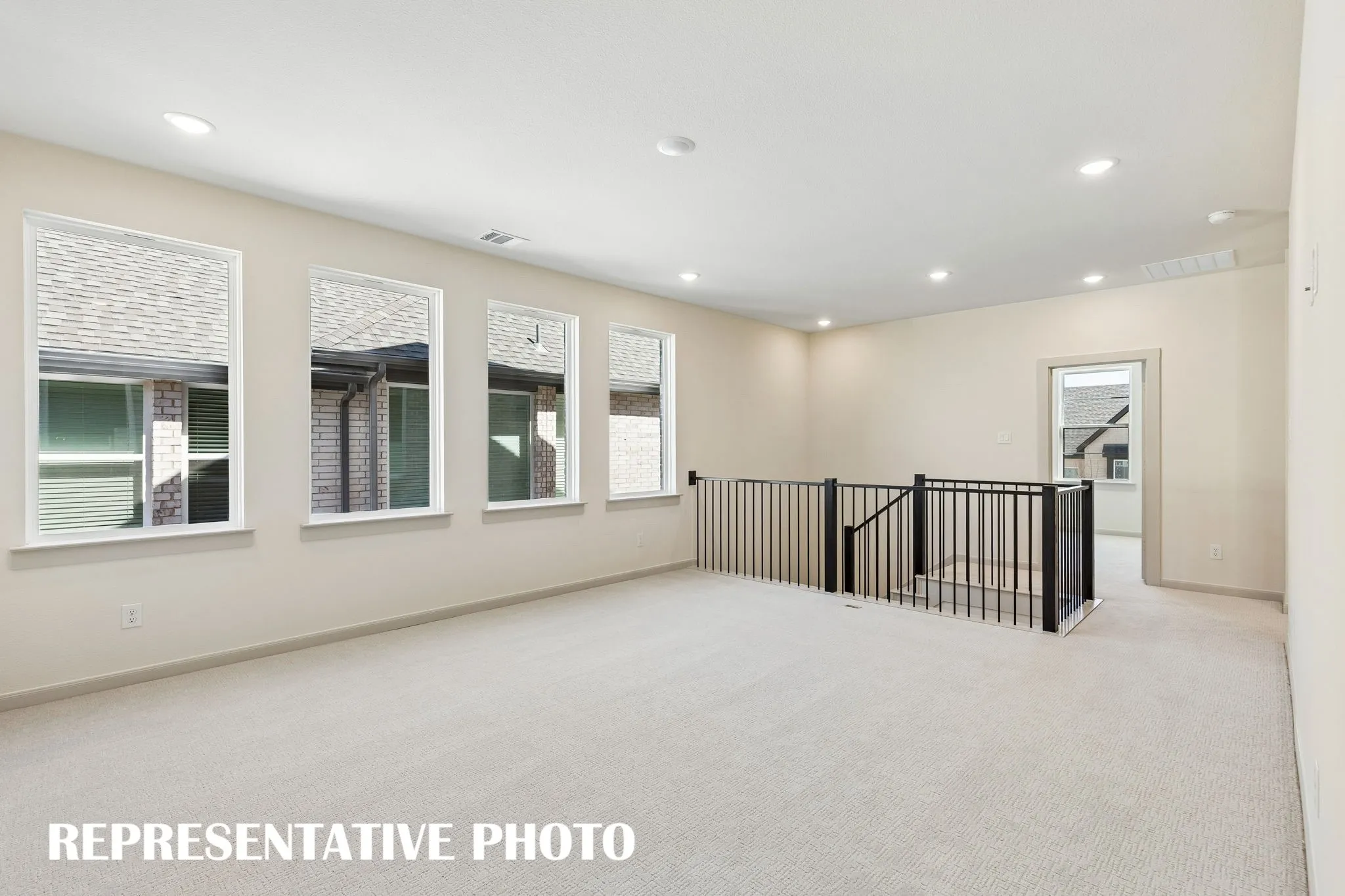 Endless hours of family fun to be enjoyed in this light and bright game room!  REPRESENTATIVE PHOTO