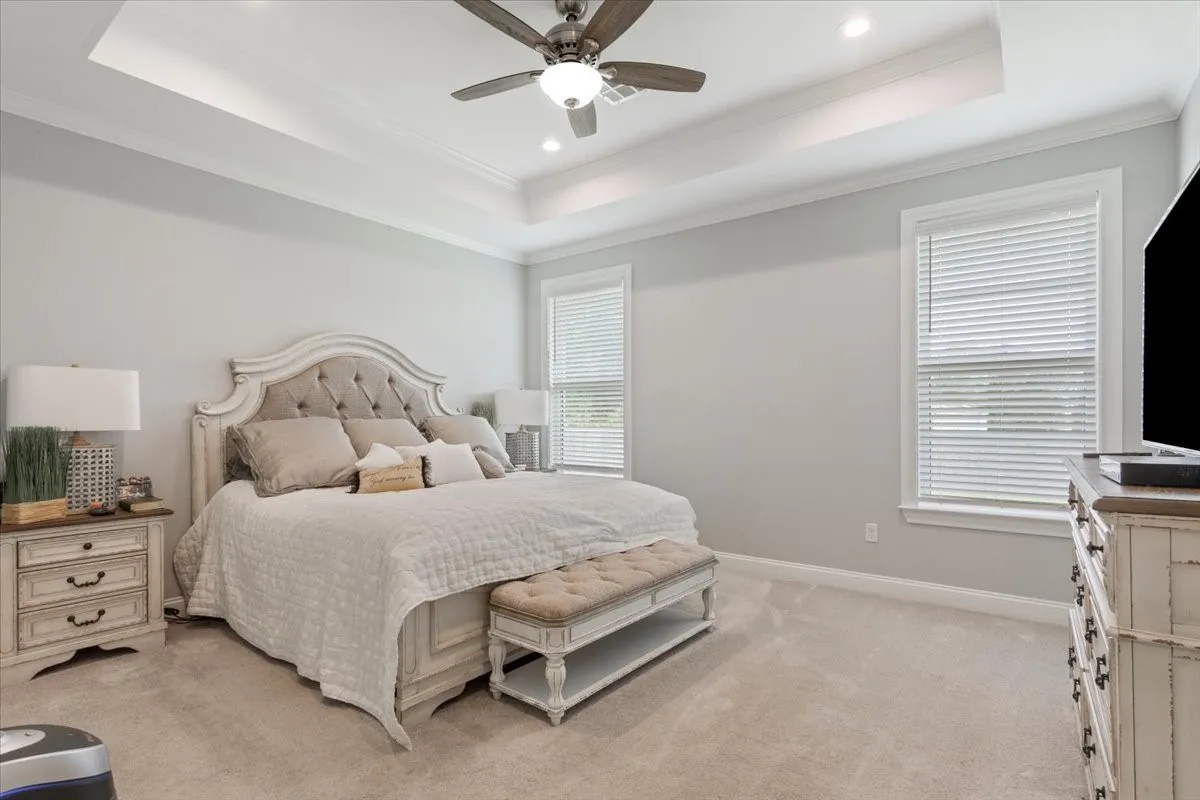 Tray ceiling with recessed lighting and a ceiling fan