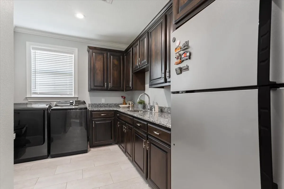 Full-size laundry room with W/D connection and extra fridge space.