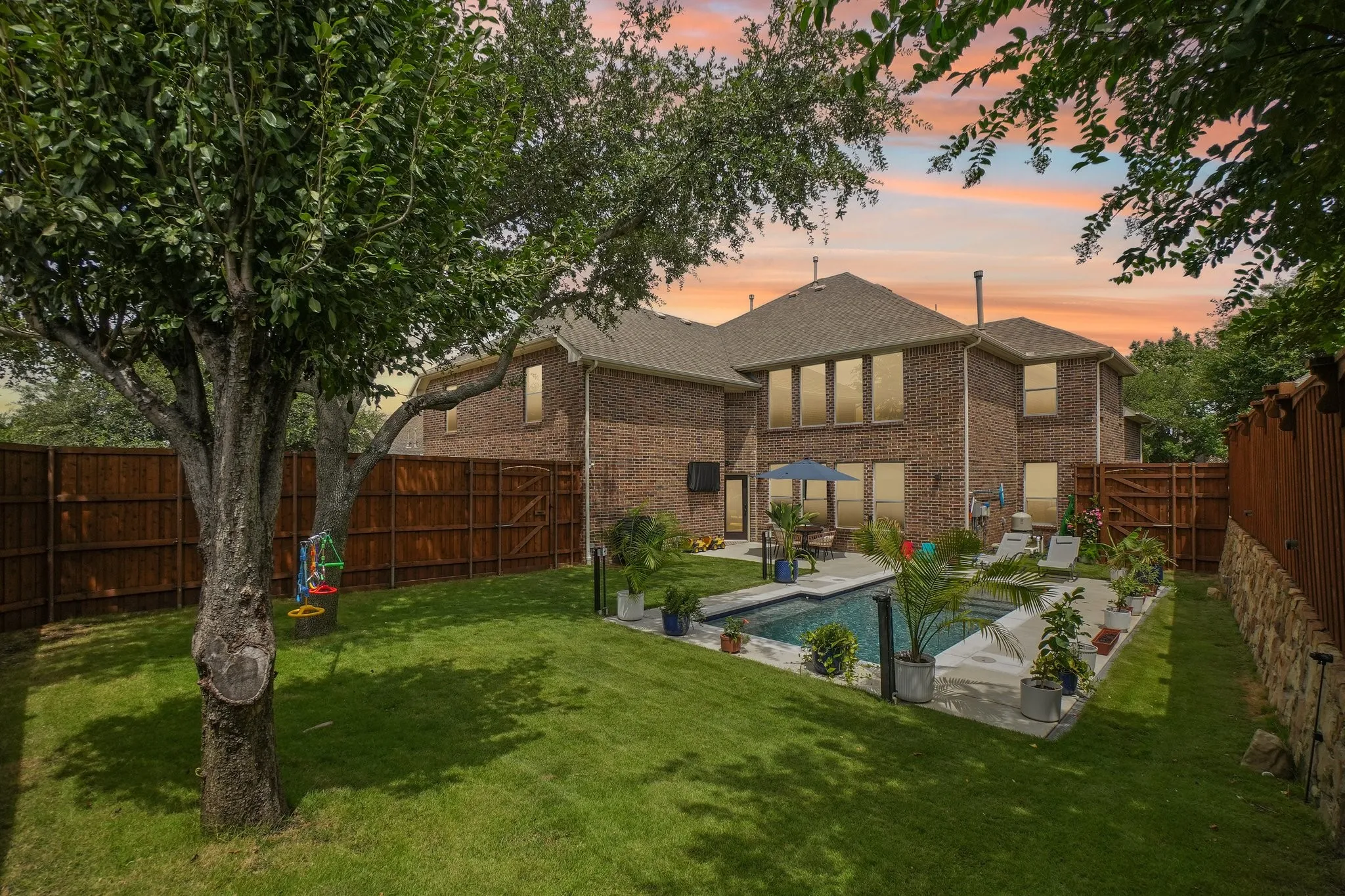 Twilight view of yard