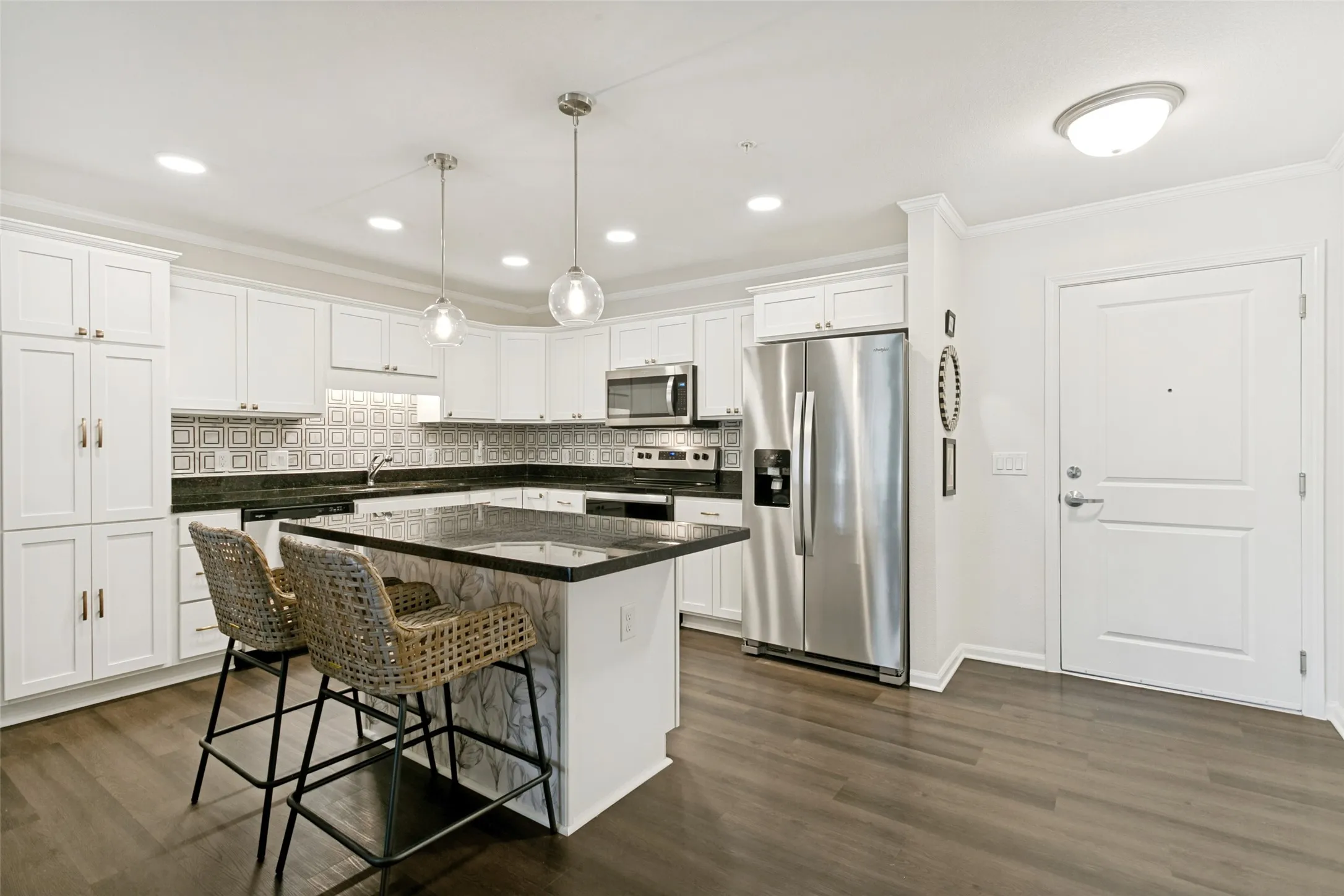 The kitchen is a home chef's dream with ample cabinet and prep space.