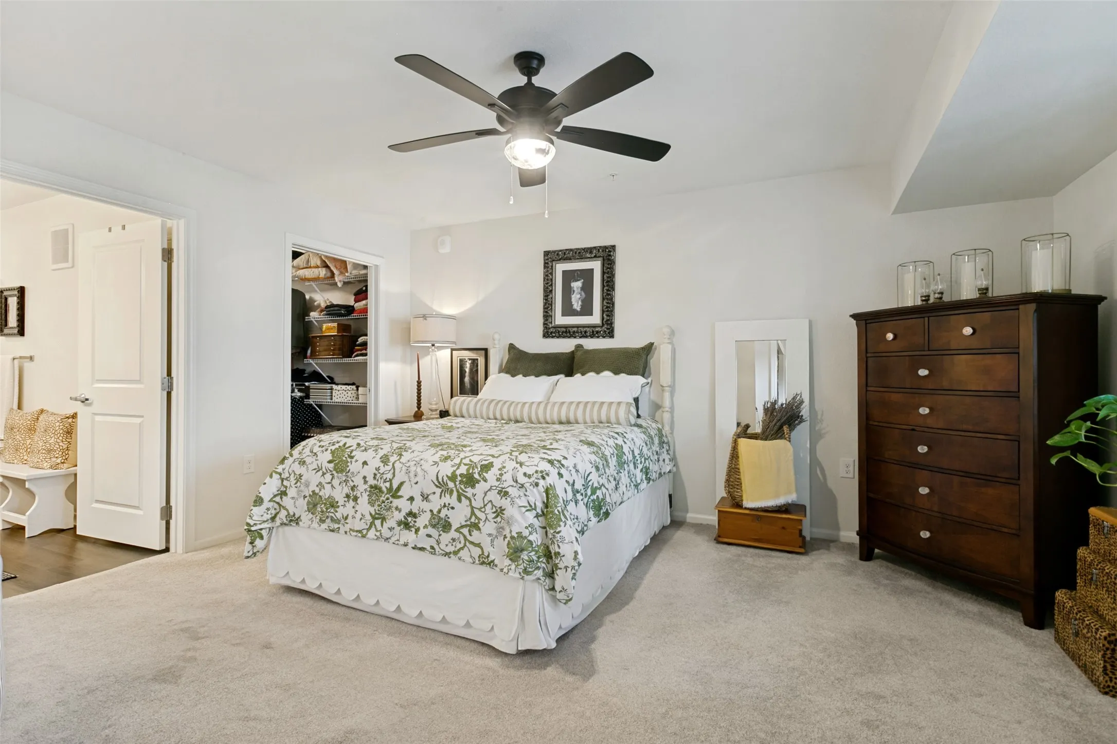 The primary suite features a well organized and spacious walk in closet.