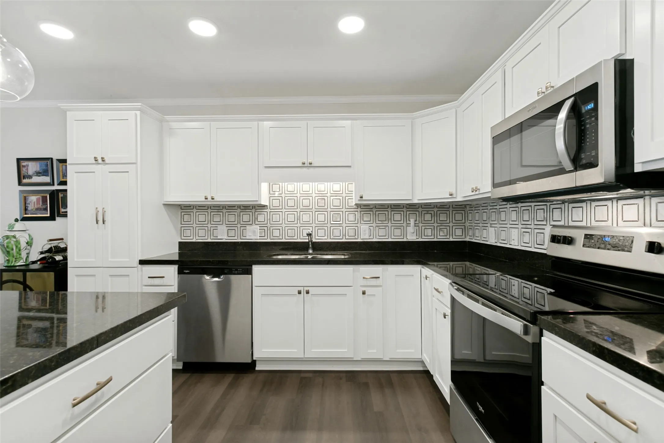 Kitchen features stainless steel appliances.