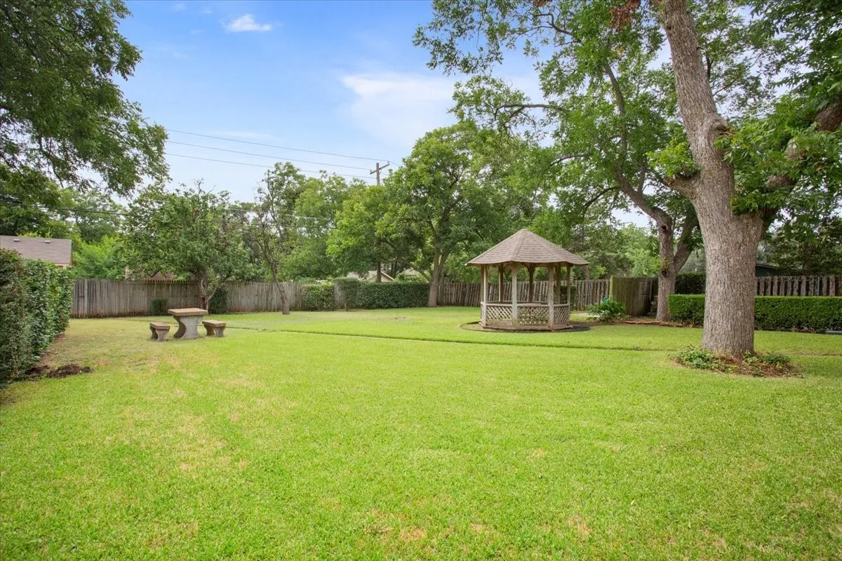 Side yard view of gazebo and picnic area