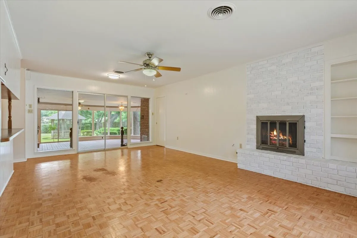 Living room with brick fireplace