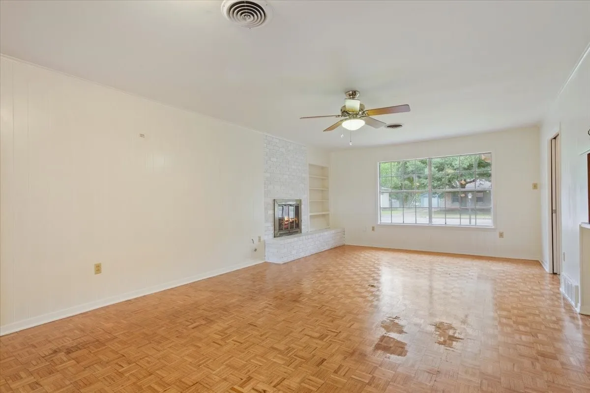 Living room with view of front yard and street