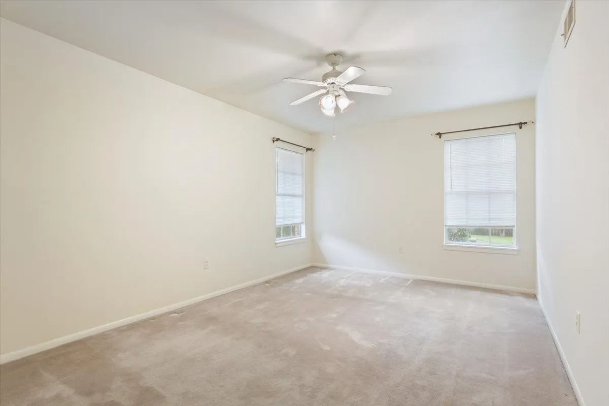 2nd bedroom with view of backyard