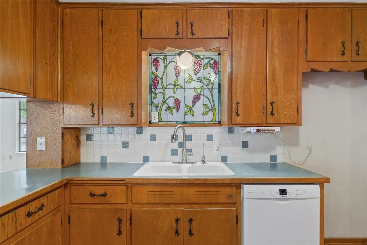 View of kitchen sink and dishwasher