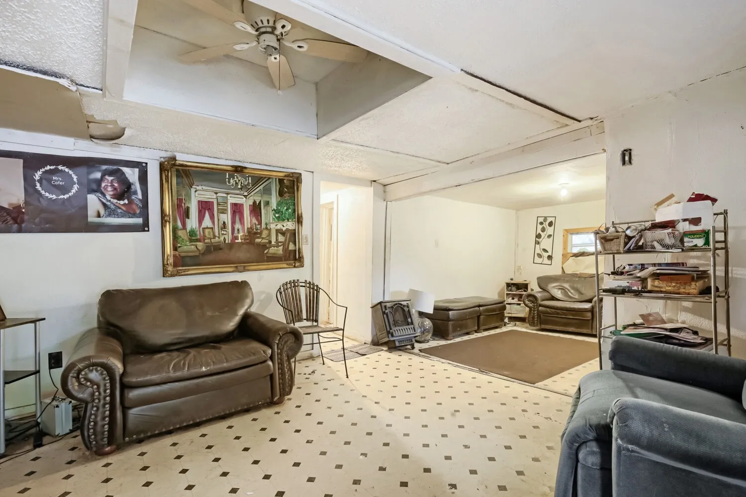Interior space featuring checkerboard pattern flooring and exposed ceiling beams