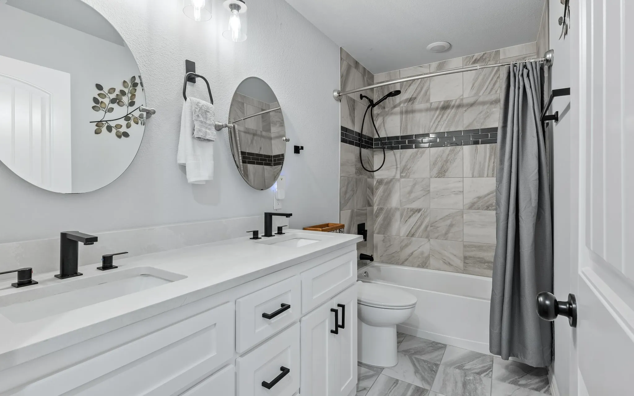 Dual vanity with integrated sinks and matte black fixtures