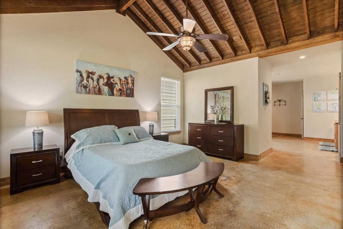 Vaulted wood-finish ceiling with exposed beams