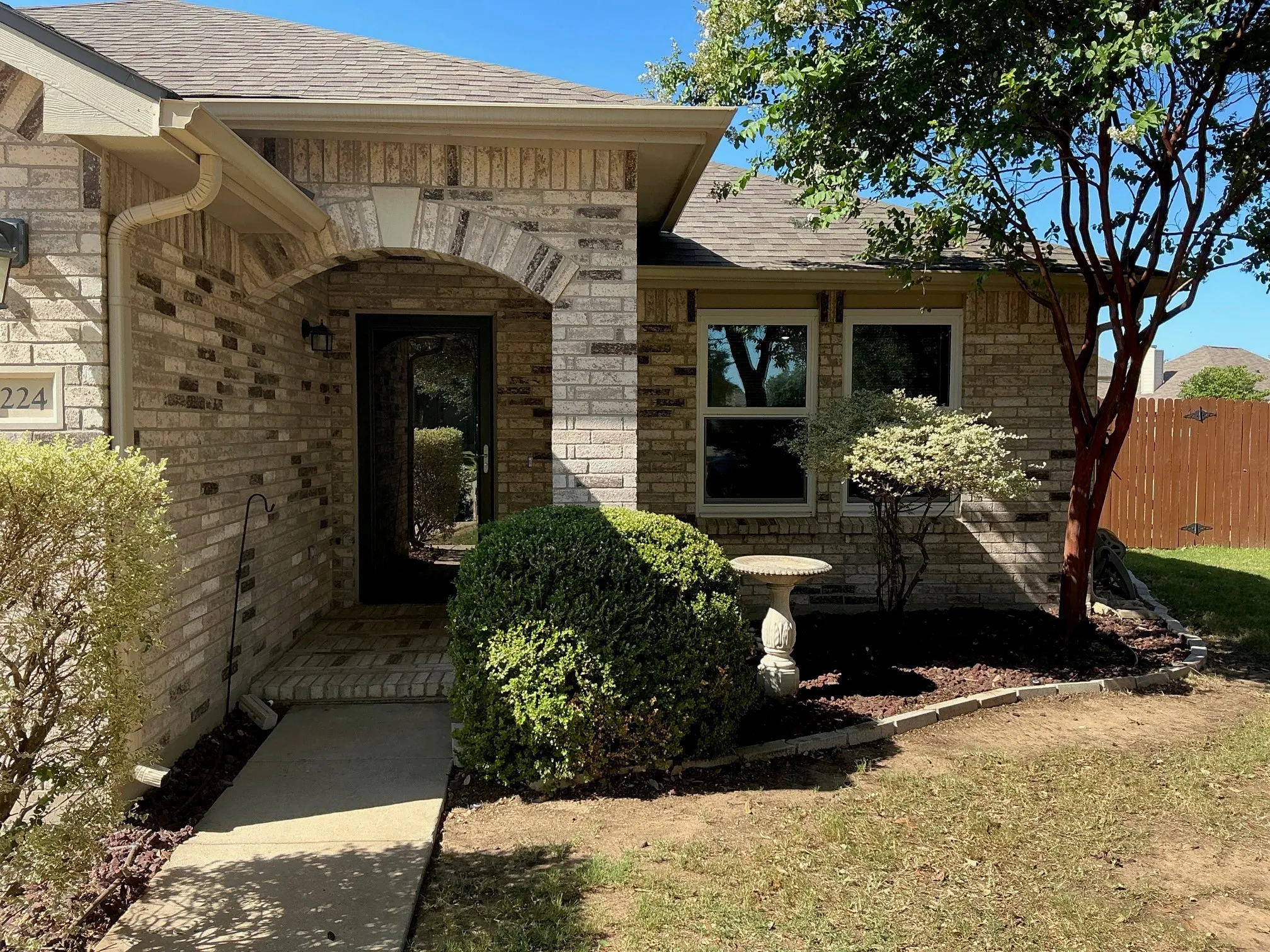 Landscaped front entry with room for your flowers