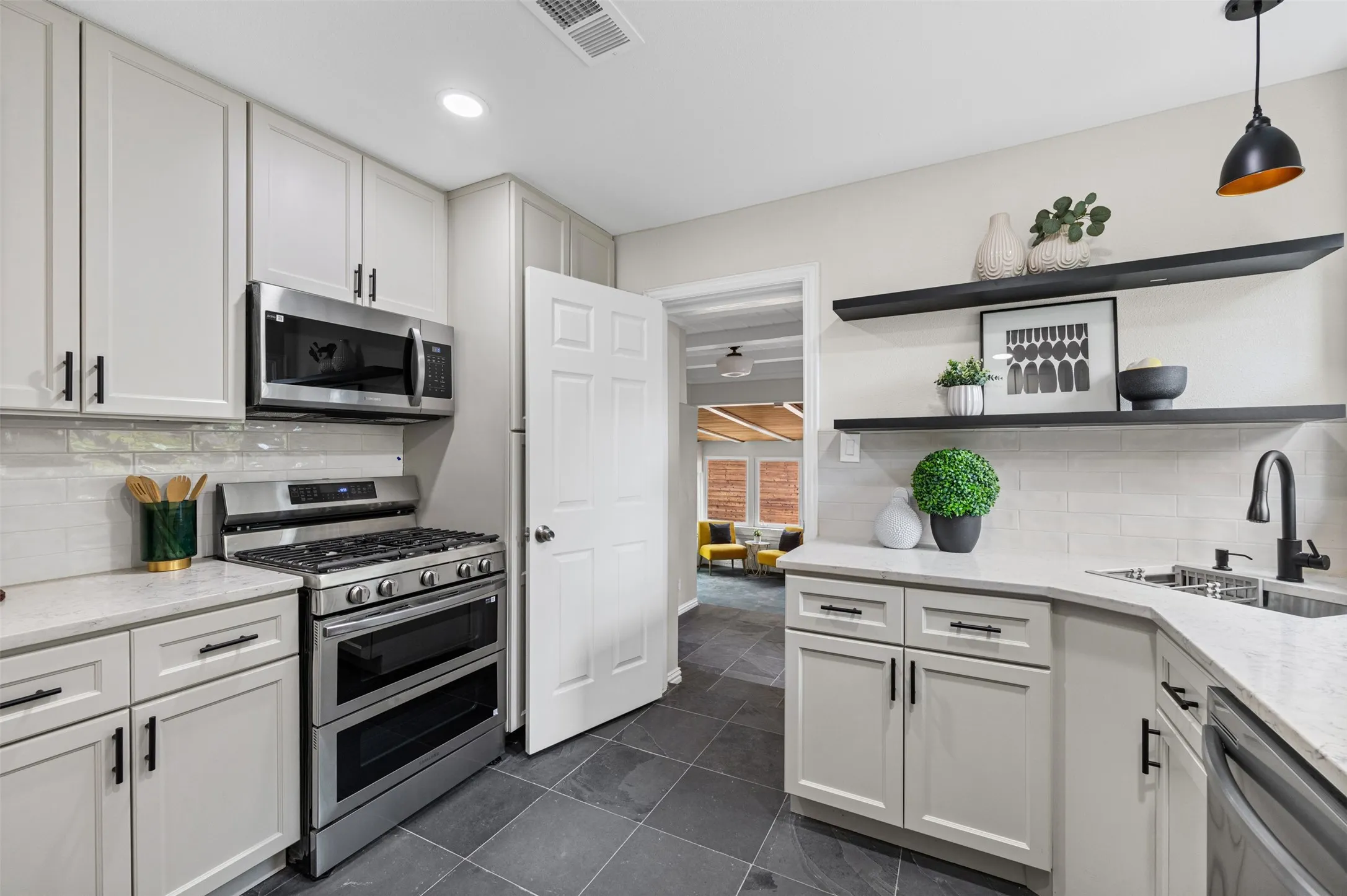 Updated kitchen leading to bedroom or living space