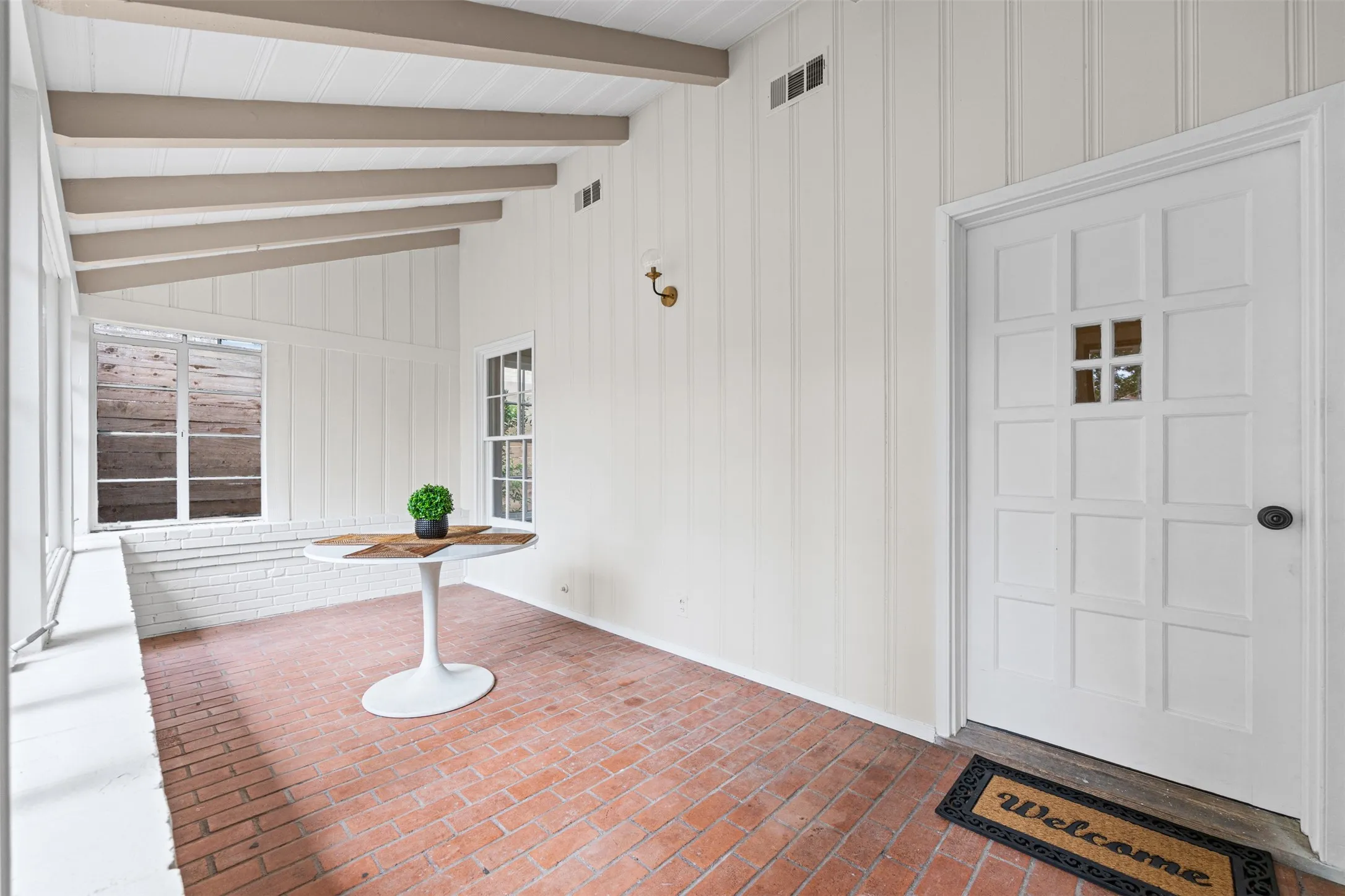 Front sunroom with beams and lots of natural light