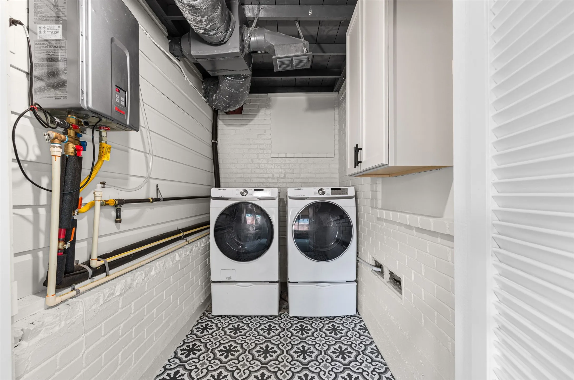 Laundry room with tankless water heater