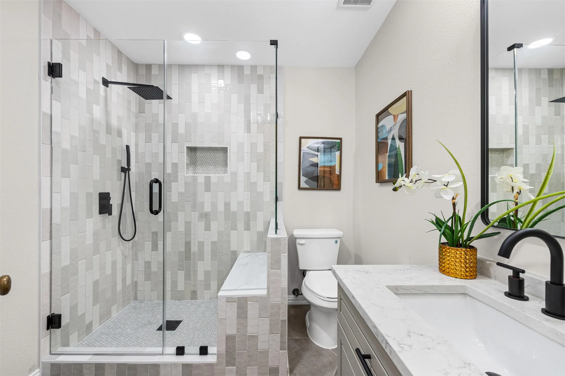 Fully updated bathroom with custom tile shower