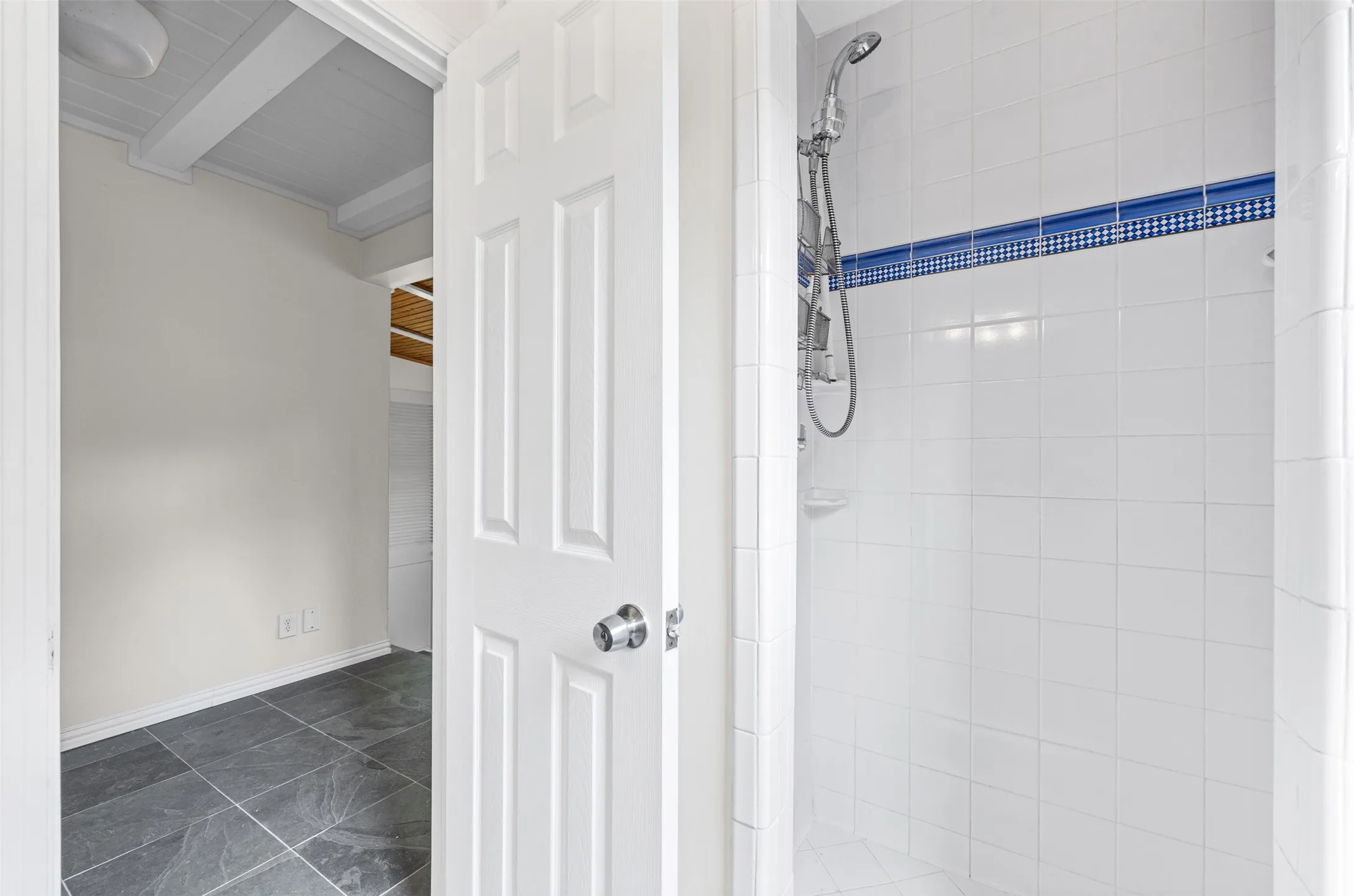 Full bathroom with tile shower