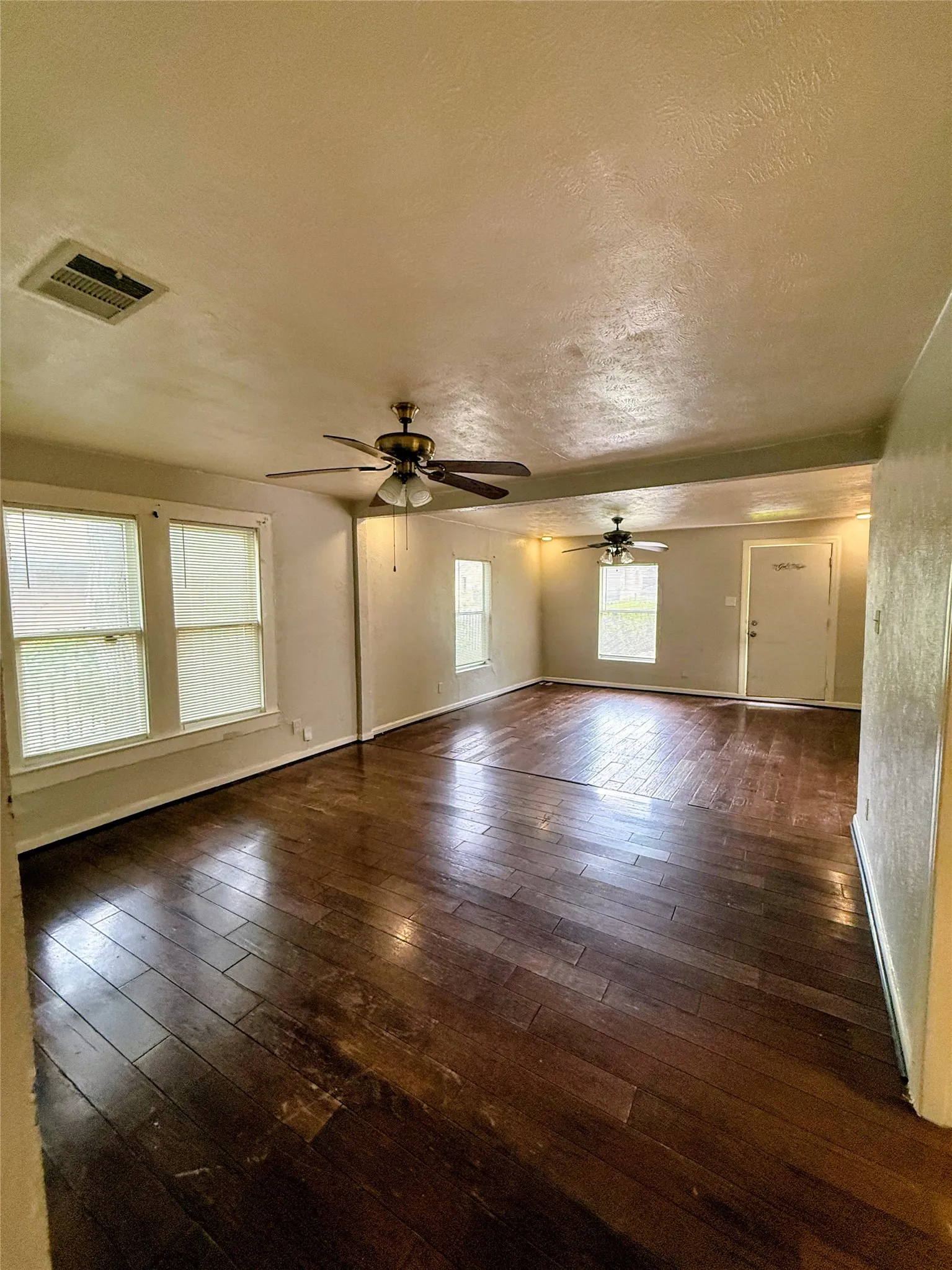 Wood floor living room from the kitchen